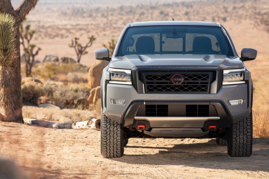 A 2022 Nissan Frontier midsize truck on display in a desert.