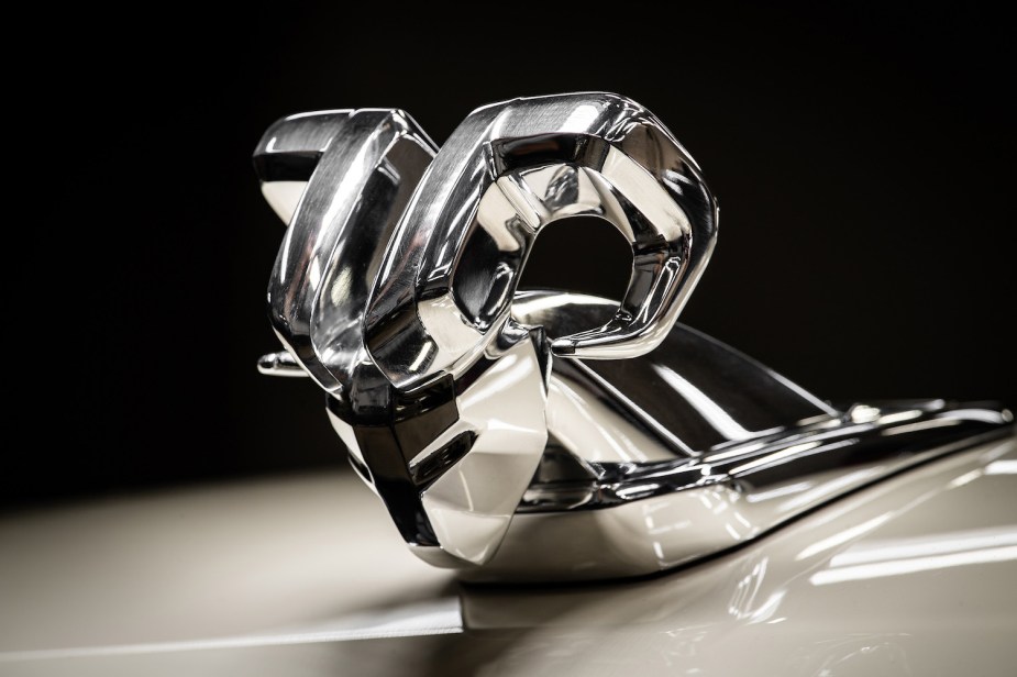 Detail shot of a modern take on the longhorm Ram hood ornament on a custom heavy-duty pickup truck.