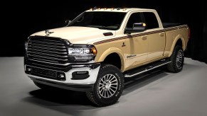 Promo photo of Chris Stapleton's custom cream-colored Ram 2500 pickup truck based on the 1979 Dodge Palomino, parked in front of a black background.