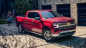 The 2023 Chevy Silverado parked near a home