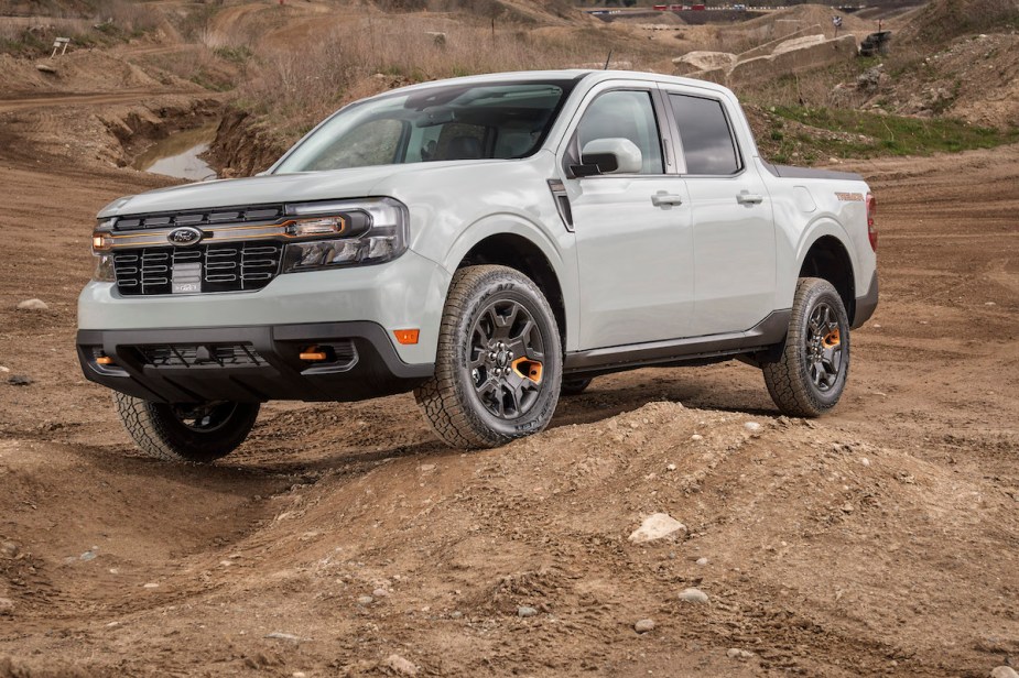 A white 2023 Ford Maverick in the desert, the cheapest compact truck.