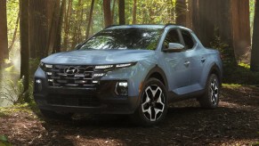 A blue 2023 Hyundai Santa Cruz small pickup truck is parked outdoors.