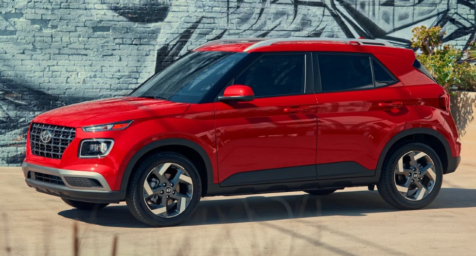 A red 2023 Hyundai Venue subcompact SUV is parked. 