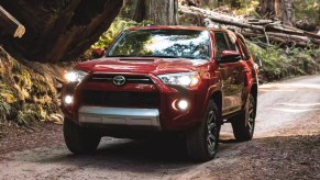 A Toyota 4Runner driving down a street.