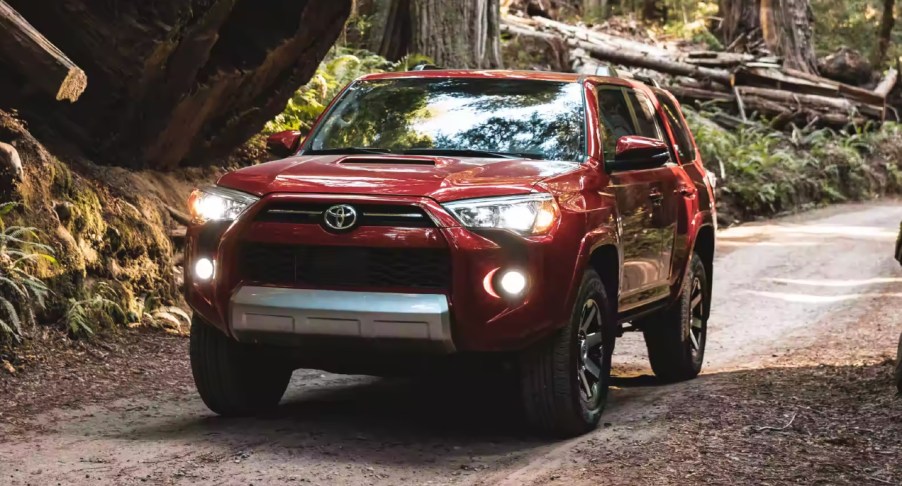 A Toyota 4Runner driving down a street.