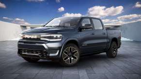 The 2025 Ram 1500 REV on display in front of the blue sky