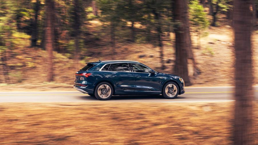 A 2023 Audi e-tron driving outside, one of the best electric SUVs for driving in snow.