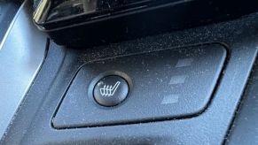 A button to turn on heated seats in a car.