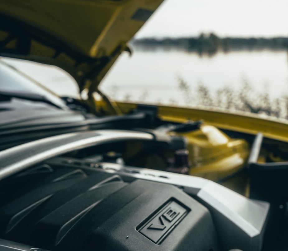 Close-up view of car engine, showing how warm with engine block heater in cold weather is better than idling