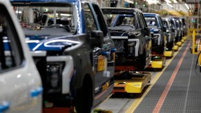 Workers assemble Ford vehicles