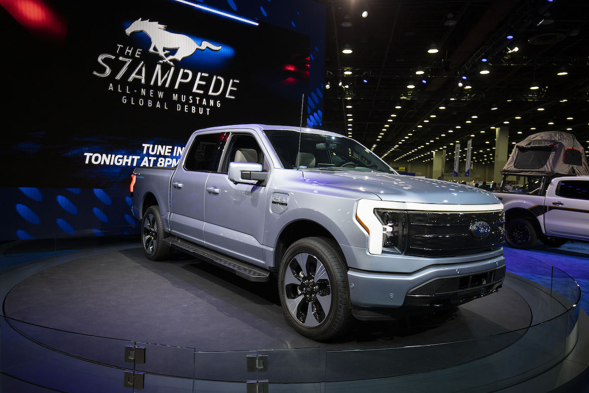 The silver Ford F-150 lightning which versus the Ford F-150 Hybrid.