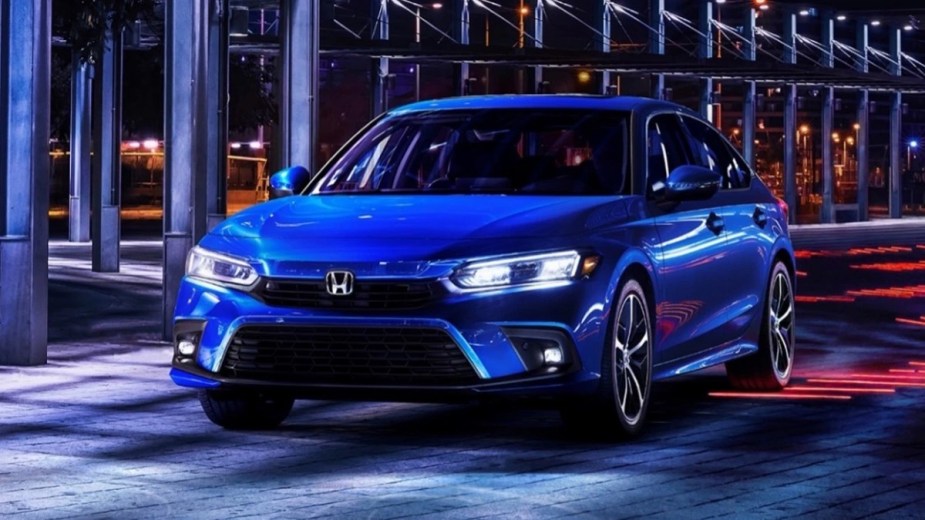 Front angle view of blue 2023 Honda Civic compact car