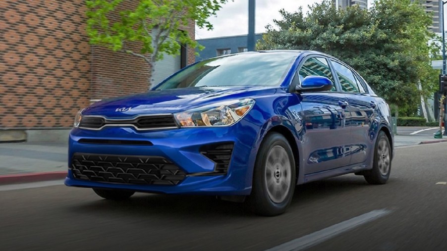 Front angle view of blue 2023 Kia Rio subcompact sedan, the cheapest new Kia car