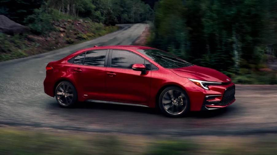 Front angle view of red 2023 Toyota Corolla Hybrid compact car