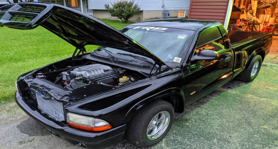 A black 2008 Dodge Dakota with a Hellcat V8 engine. 