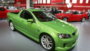 Bright green special edition of Holden's Ute compact coupe utility pickup truck parked at the Australian auto show.