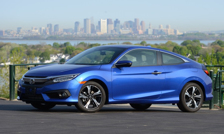 The Honda Civic Coupe, like this blue coupe, is among the Honda cars that are the best for the money.