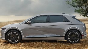 A gray 2023 Hyundai Ioniq 5 small SUV is parked.