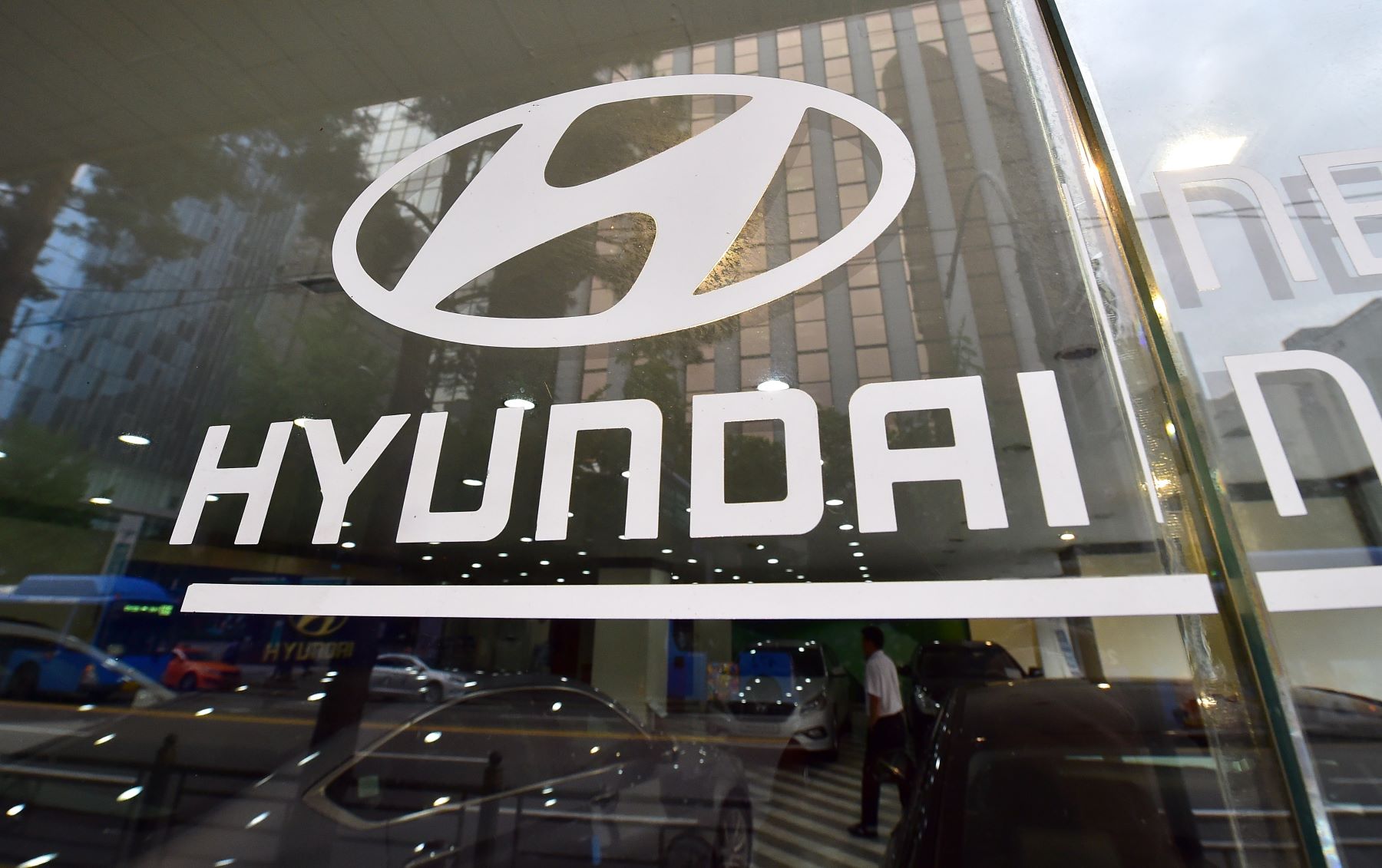 The Hyundai logo and print on glass at a company branch in Seoul, South Korea