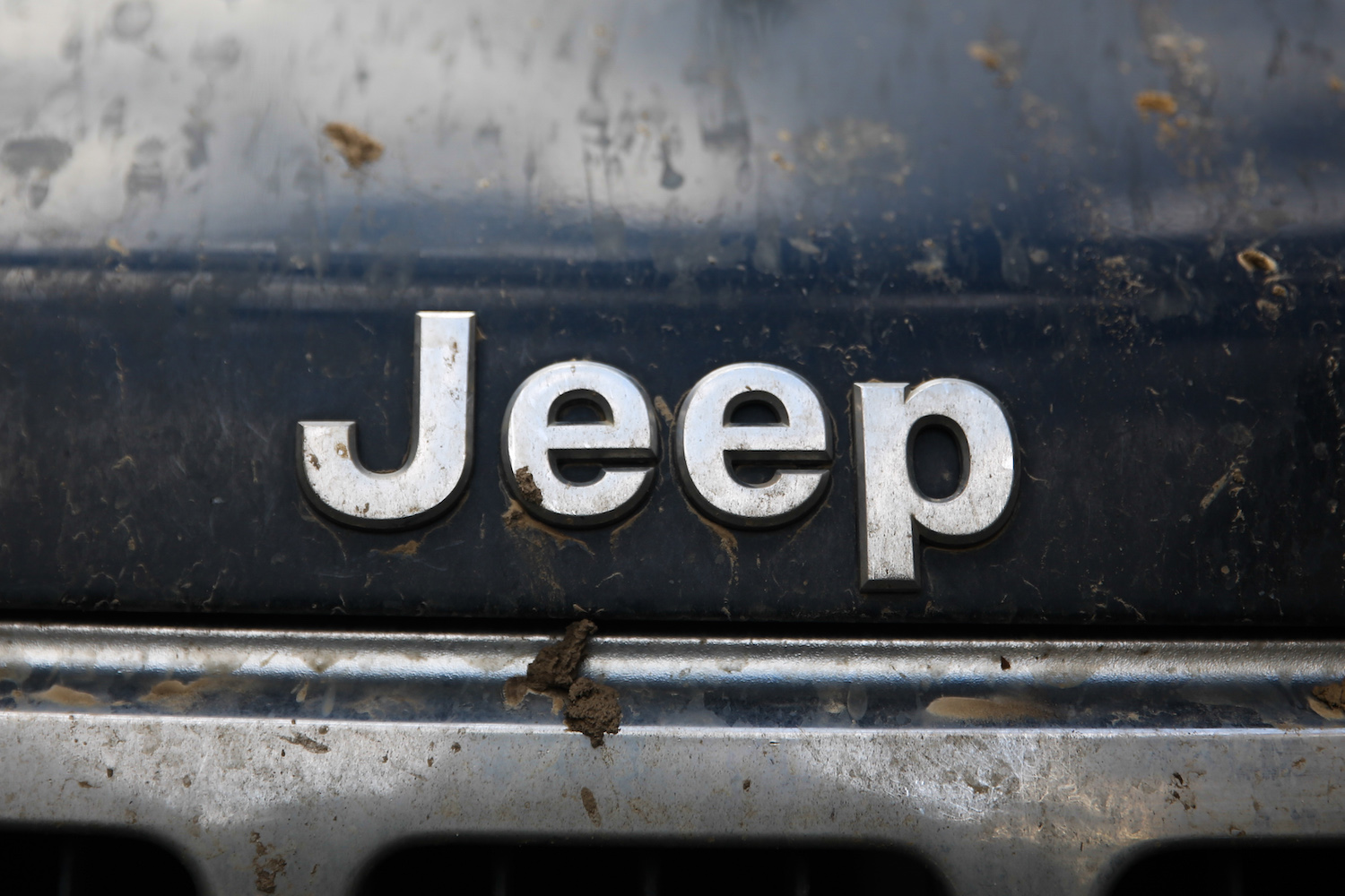 Jeep name logo on a black car.