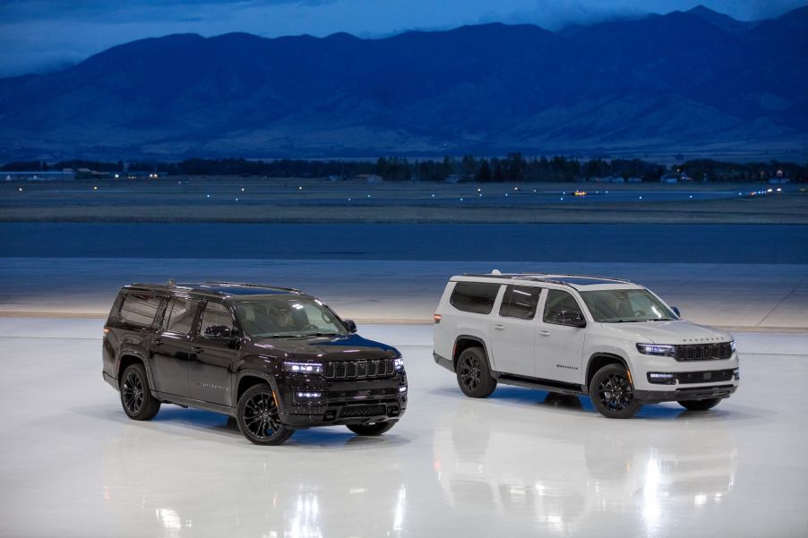 A black Jeep Grand Wagoneer L Obsidian and white 2023 Jeep Wagoneer L Carbide full-size luxury SUV models