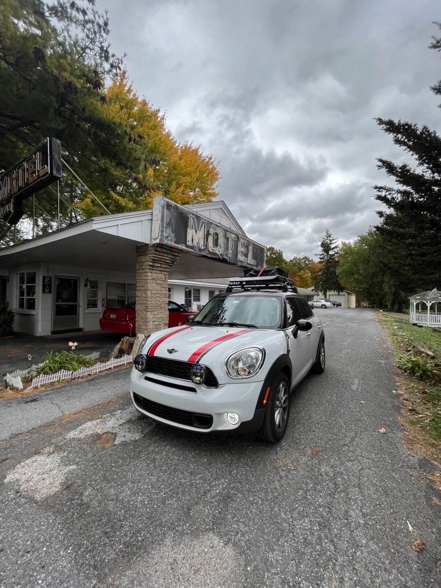 Mini Cooper packed up in front of a motel while traveling with a newborn