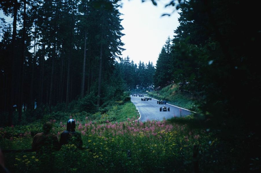 Cars racing around the track at Nürburgring.