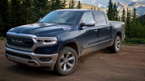 A blue 2023 Ram 1500 full-size pickup truck is parked.