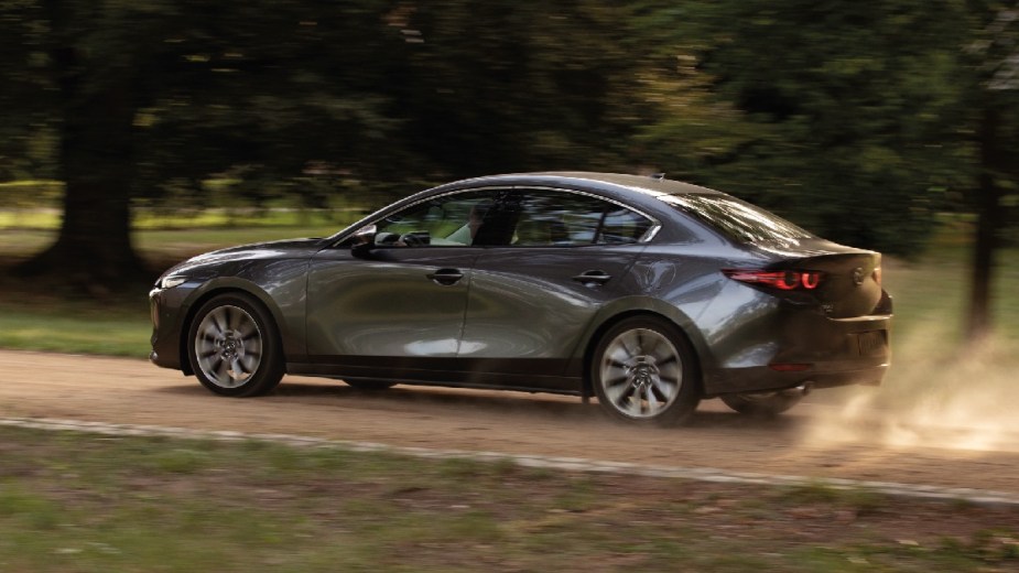 Rear angle view of gray 2023 Mazda3 Sedan, the cheapest new Mazda car