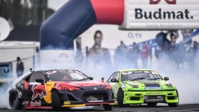 A red and green S14 Silvia racing down the track.