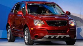 A red Saturn Vue on display at an auto show