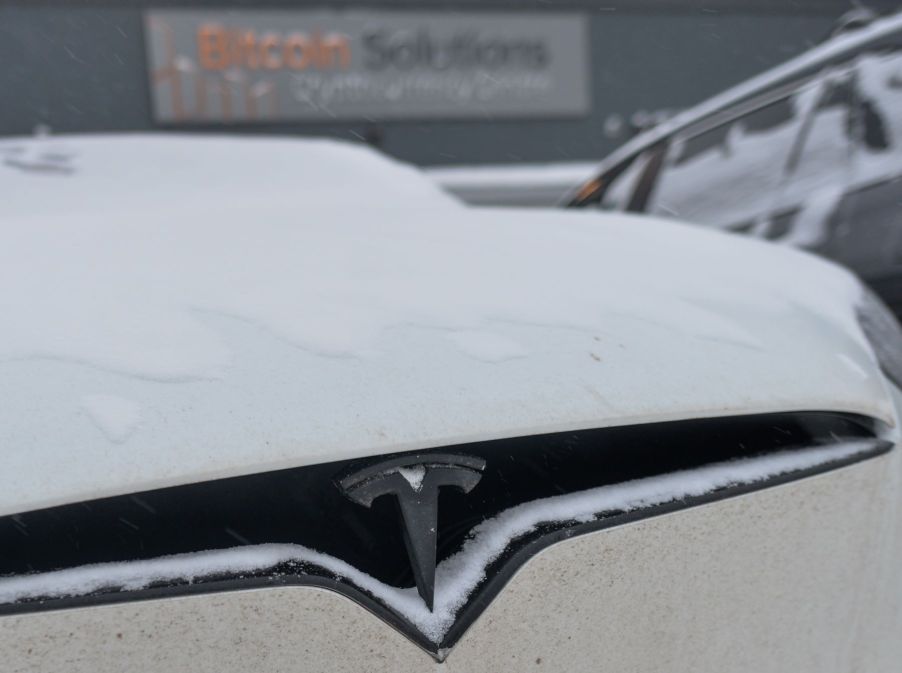 A Tesla EV with a heat pump covered in winter snow in Edmonton, Alberta, Canada