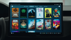 A Tesla infotainment screen features tons of Steam video games playable through the console.