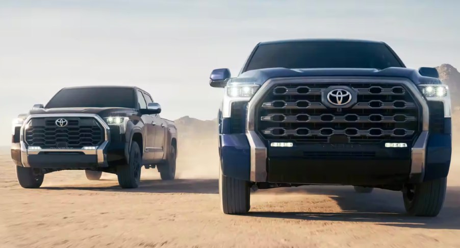 Two Toyota Tundra models driving on a dirty road. A used Toyota Tundra is still great value