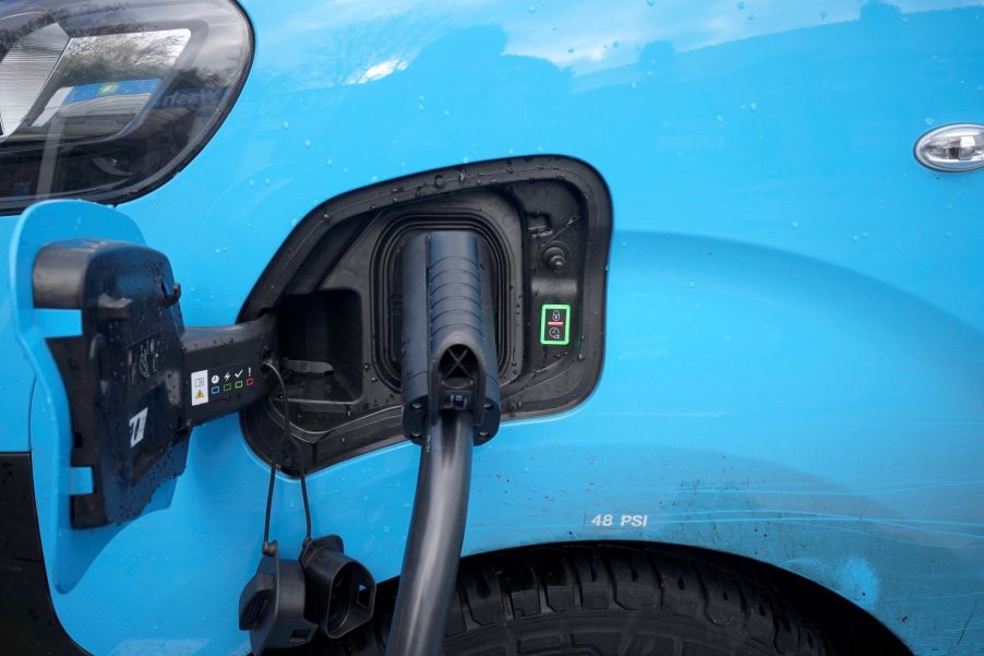 An electric vehicle (EV) battery charging outlet on a British Gas van at a Motor Fuel Group EV Power forecourt