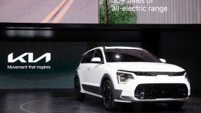 2023 Kia Niro EV in white at an auto show