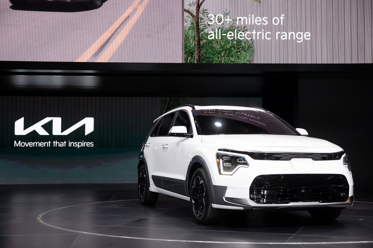 2023 Kia Niro EV in white at an auto show