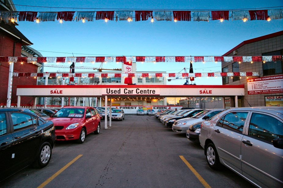 Used car lot featuring several cars for sale