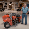 Jay Leno stands next to the 1940 Indian motorcycle he crashed in January 2023