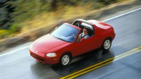 An overhead shot of a red 1995 Honda Civic Del Sol VTEC convertible model