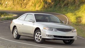 A 2003 Toyota Solara driving down road.