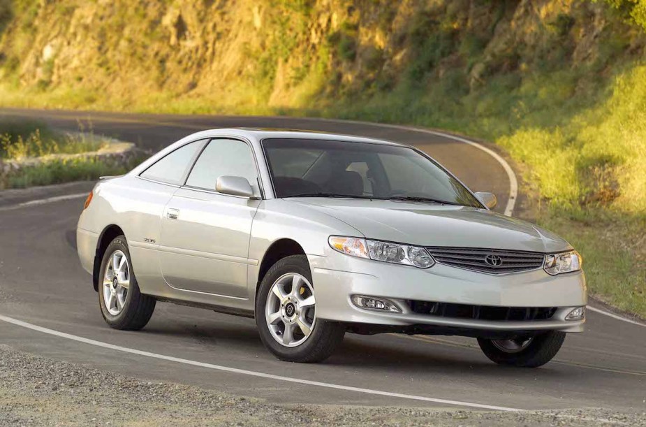 A 2003 Toyota Solara driving down road. 