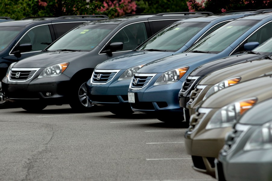 2010 Honda Odyssey minivan models in a used car lot somewhere in 2010.