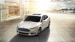 A white 2015 Ford Fusion parked outdoors.