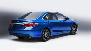 A blue 2016 Toyota Camry on dislay.