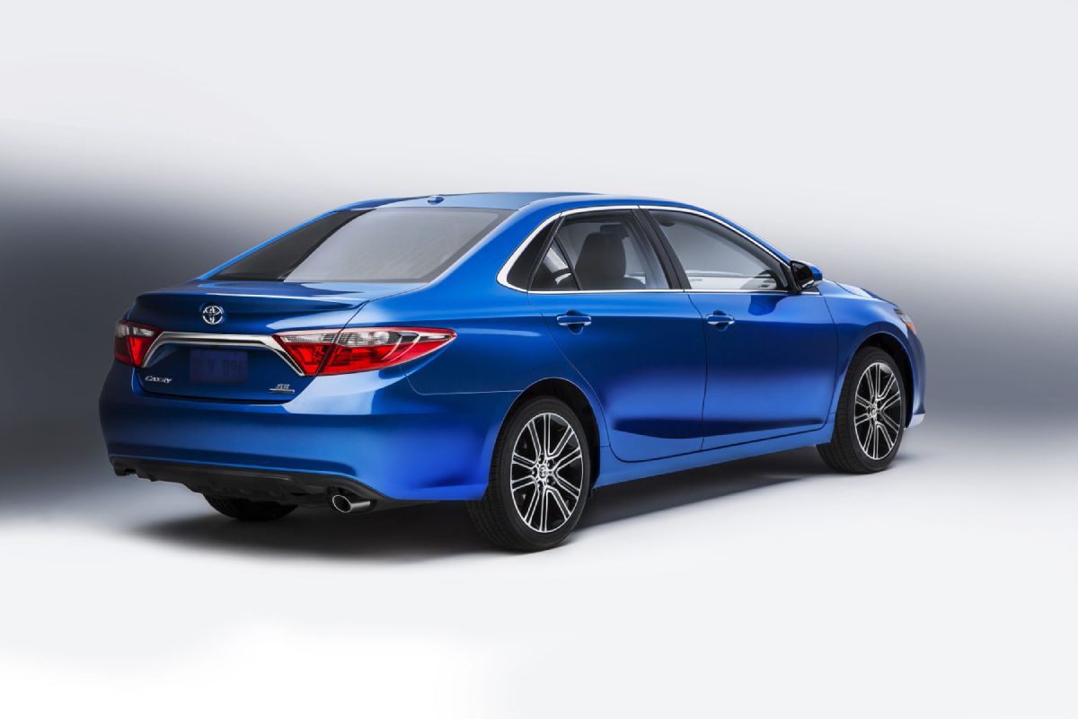 A blue 2016 Toyota Camry on dislay.