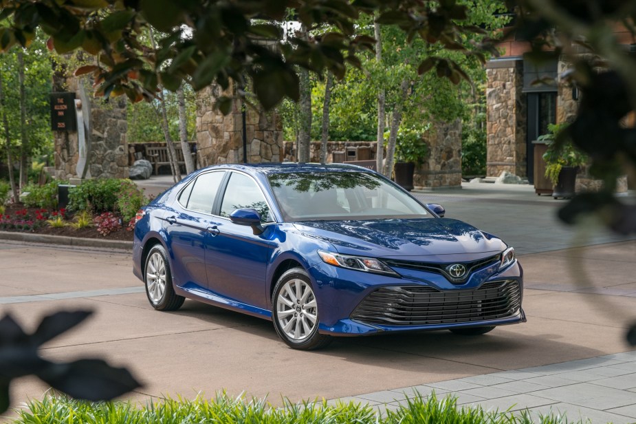 A used Toyota Camry poses for a picture.