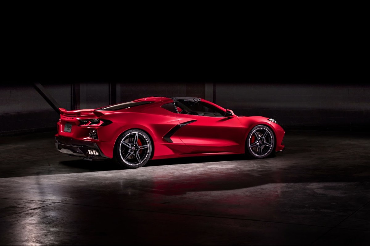 A red C8 Corvette from the rear three-quarter angle