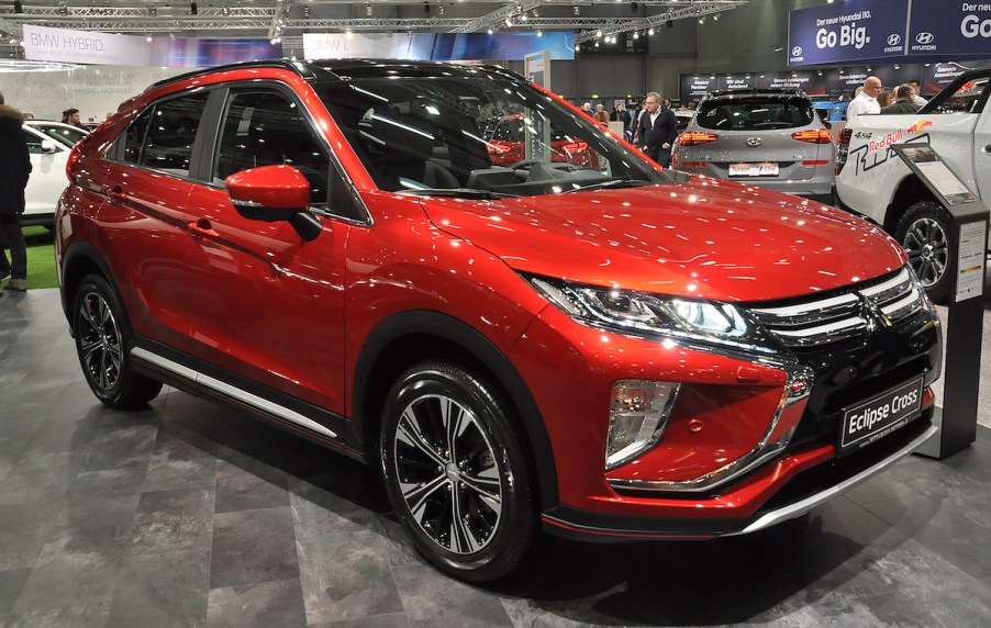 A 2020 Mitsubishi Eclipse Cross in red parked indoors.