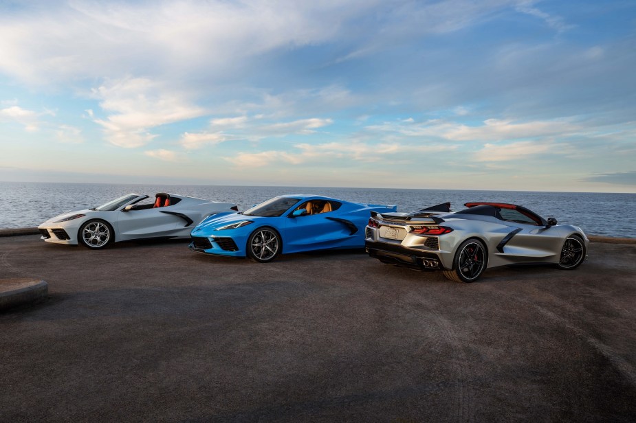 New Chevrolet Corvettes show off their styling and convertible tops at the beach.